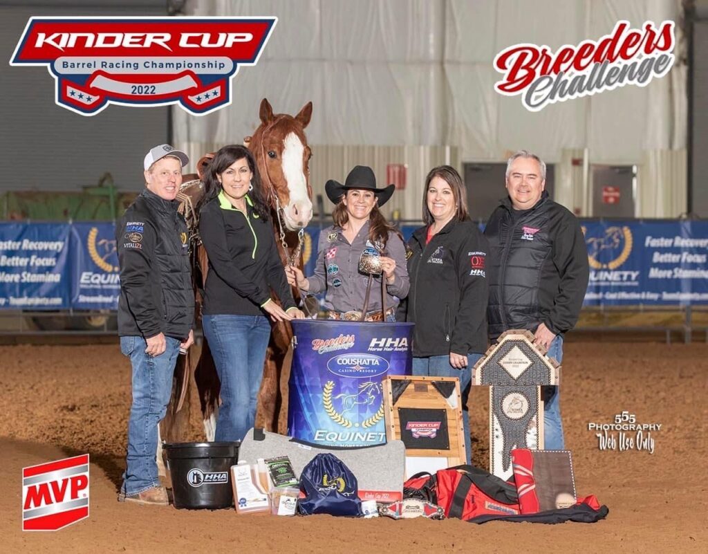 Brittany Pozzi Tonozzi poses with her stallion and other people with awards in a row