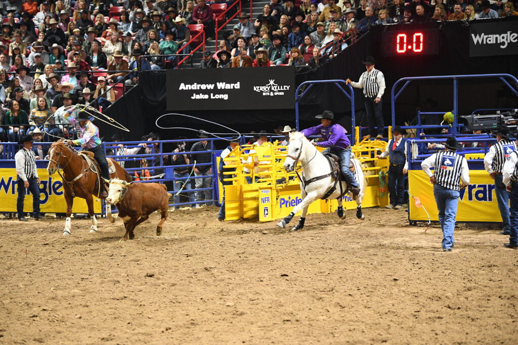 Andrew Ward and Jake Long rope their 10th-round steer at the 2025 NFR, with Long heeling on Copper.