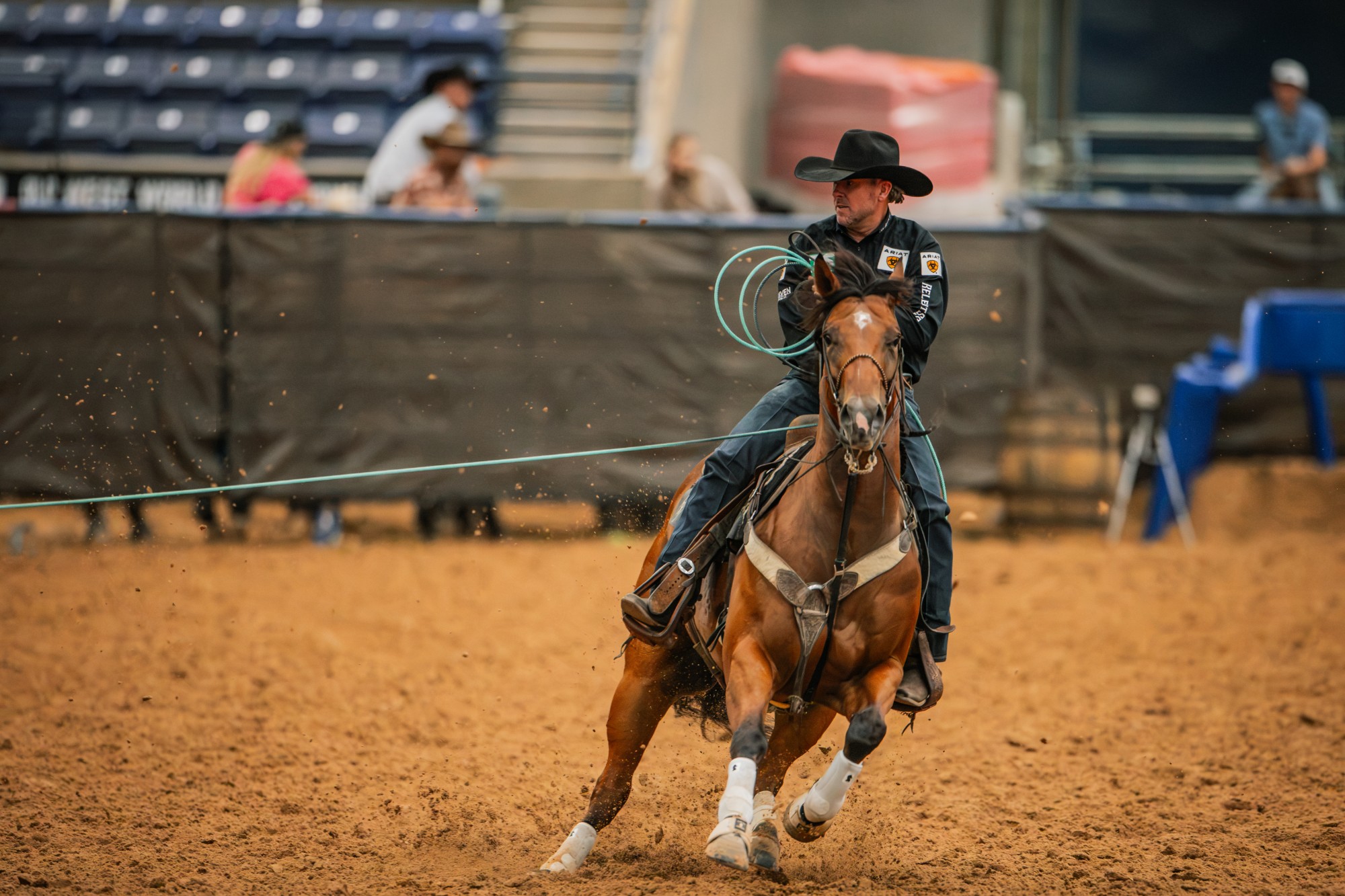 Trevor Brazile turns Kiri toward the camera with his rope dallied in the Amarillo arena.